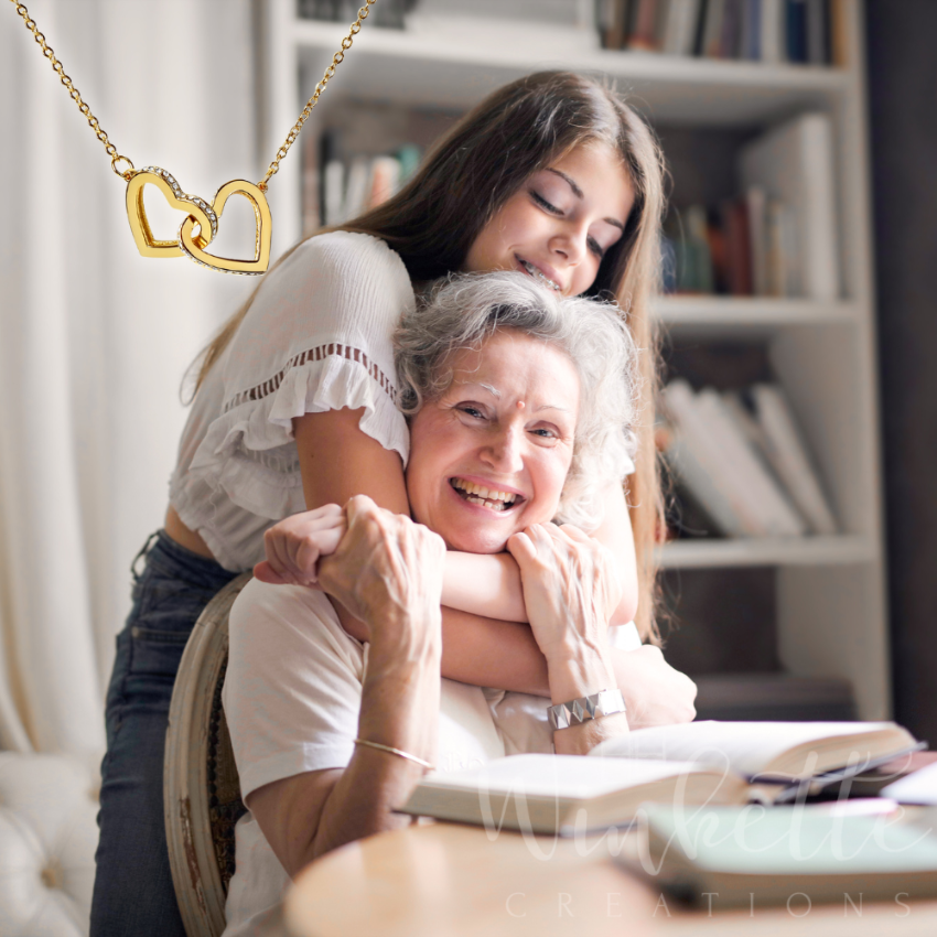 Grandma and granddaughter hugging with a blurred background