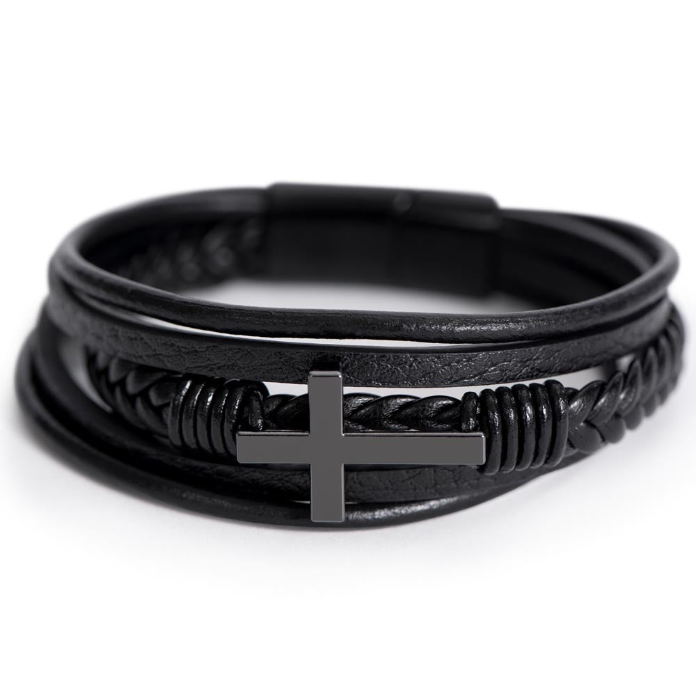 Close-up of black leather cross bracelet for son with stainless steel cross centerpiece.