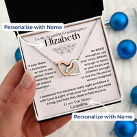 Thumbnail for A personalized Interlocking Hearts Necklace presented in a box with a heartfelt message card, intended as a gift for a granddaughter. The necklace features two hearts with Cubic Zirconia stones, and the ability to customize with a name.