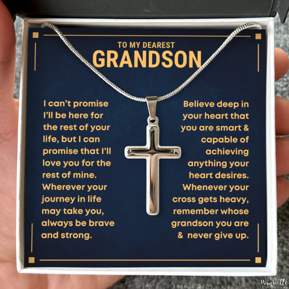 Cross necklace in a decorative box with personalized message to a grandson from grandma grandpa.
