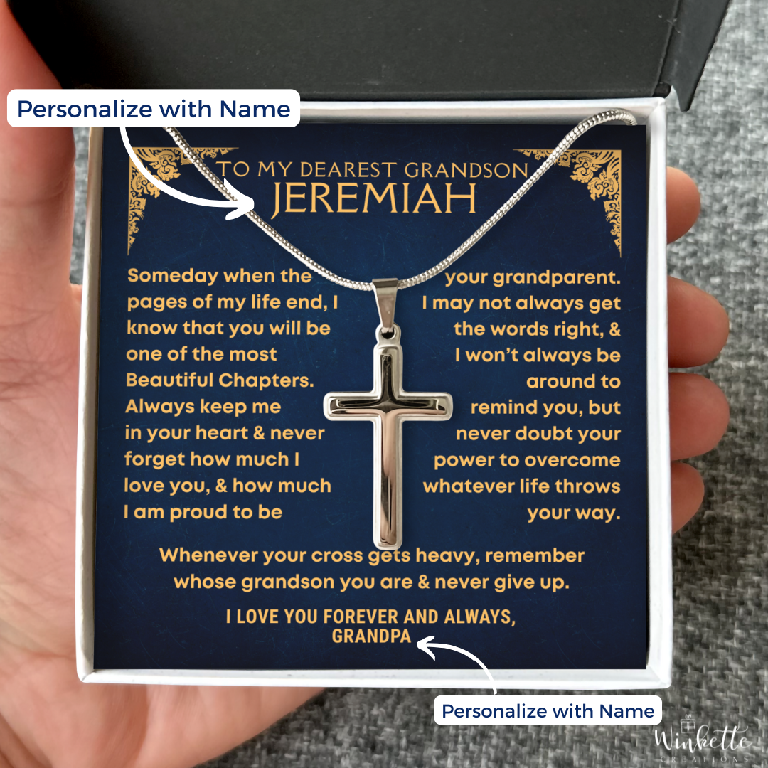 Cross necklace in a gift box with personalized message, held by a hand. gift for grandson from grandfather