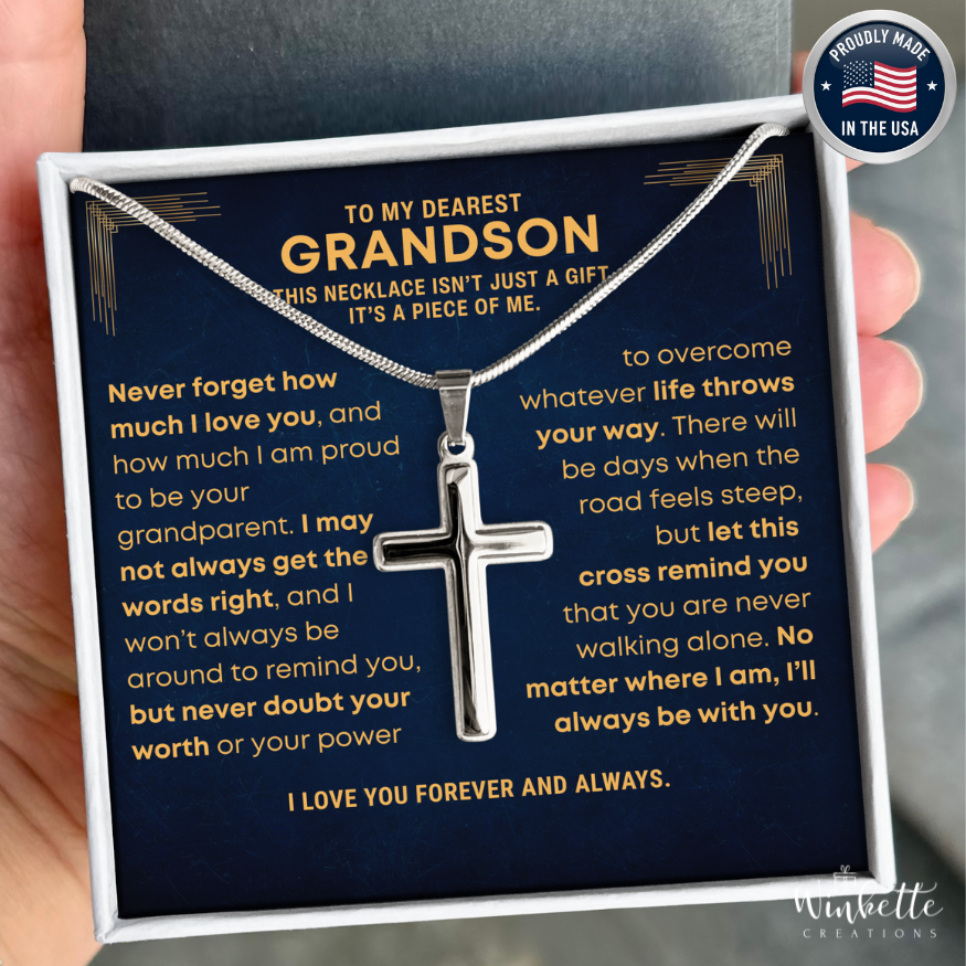 Grandson Cross Necklace in a box with sentimental message, held by a hand. Gift for grandson from grandparent grandma grandpa