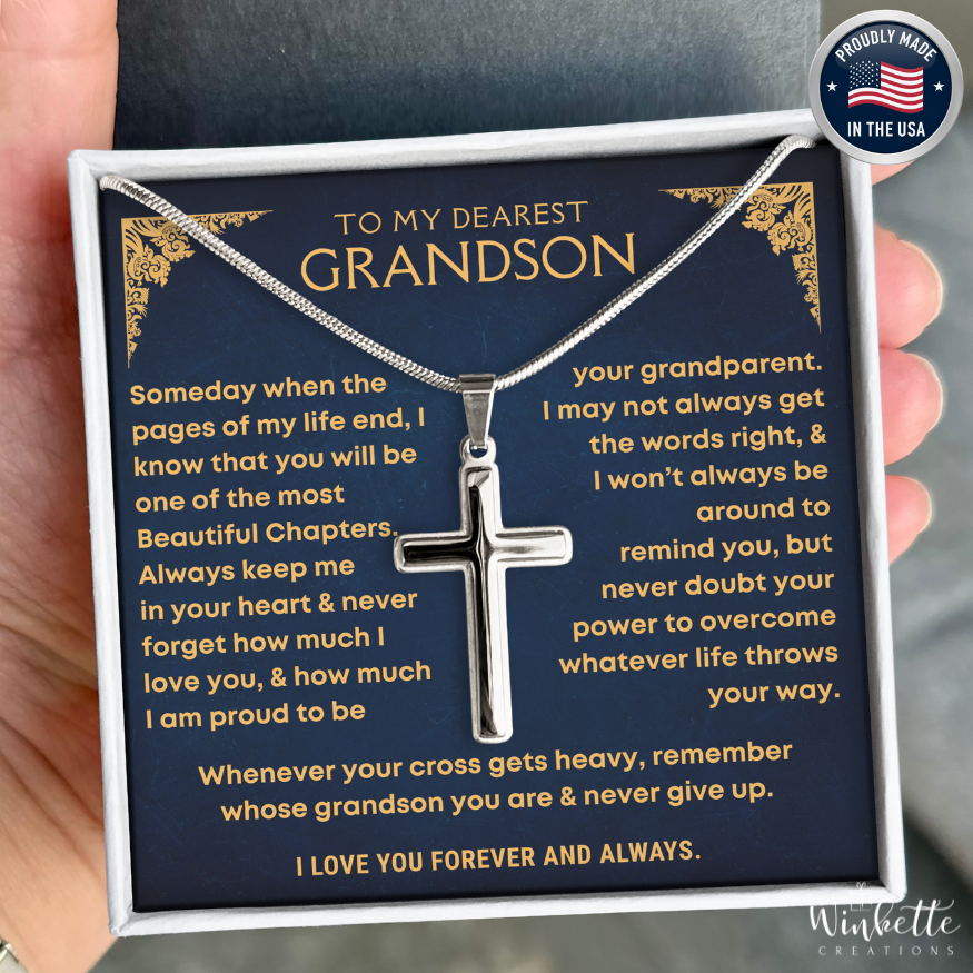 Grandson Necklace with cross pendant in a heartfelt message card held by a hand