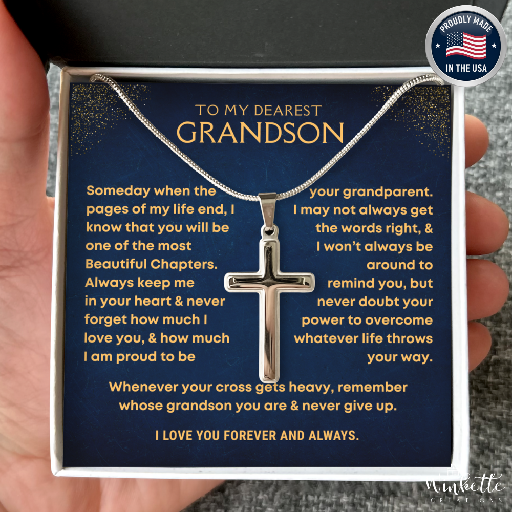 Grandson Necklace with cross pendant in a heartfelt message card held by a hand