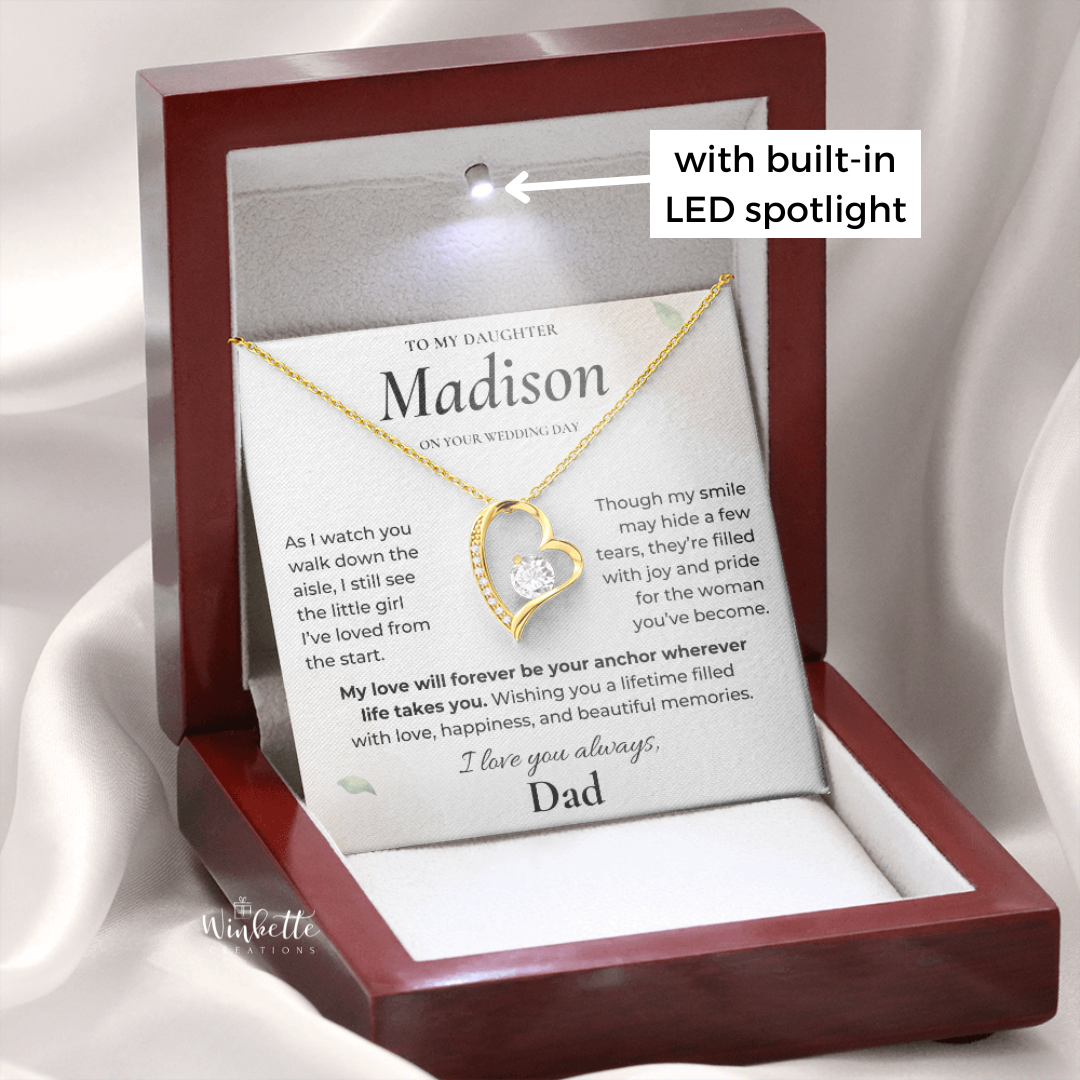 Gold daughter wedding necklace displayed in luxury wooden LED gift box with personalized message card.