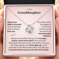 Thumbnail for Hands holding a classic white jewelry box with a silver Love Knot necklace and pink “To My Granddaughter” message card, sentimental granddaughter gift from grandma.