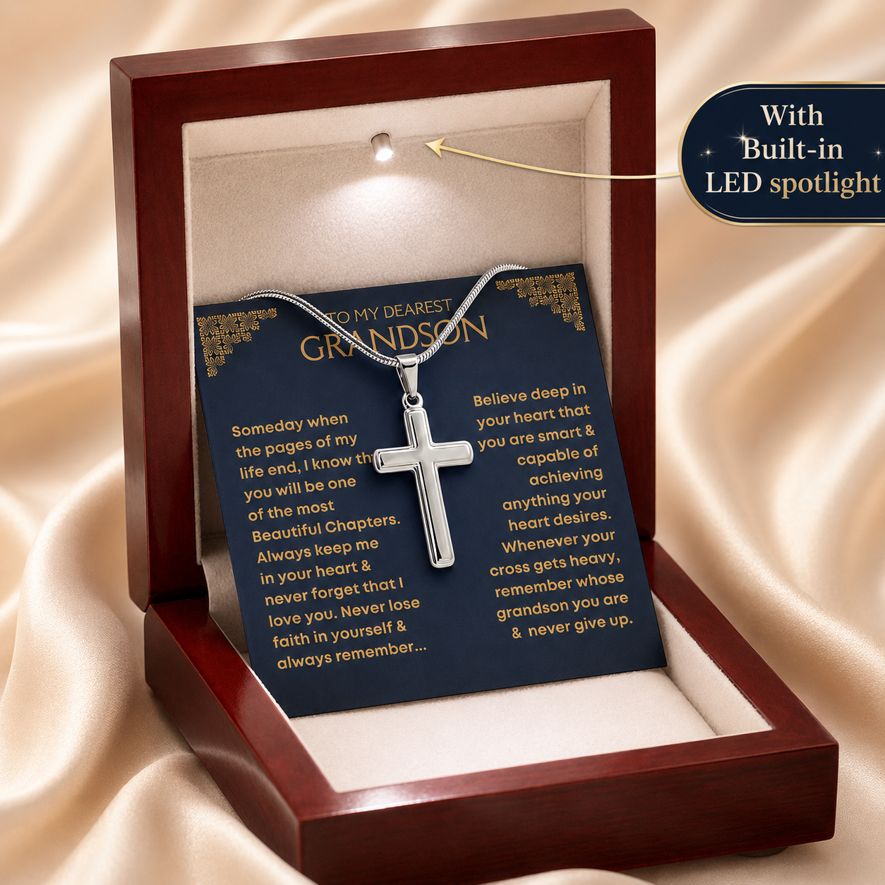 A silver cross pendant necklace presented in a luxury wooden gift box with a dark blue message card addressed to a grandson. Perfect gift for grandson