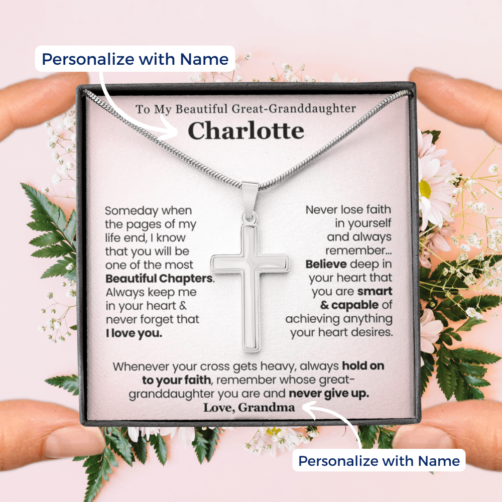 Great-granddaughter Necklace with cross pendant in a personalized message box held by hands. 