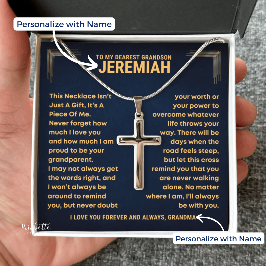 Cross necklace in a gift box with personalized message, held by a hand. gift for grandson from grandfather