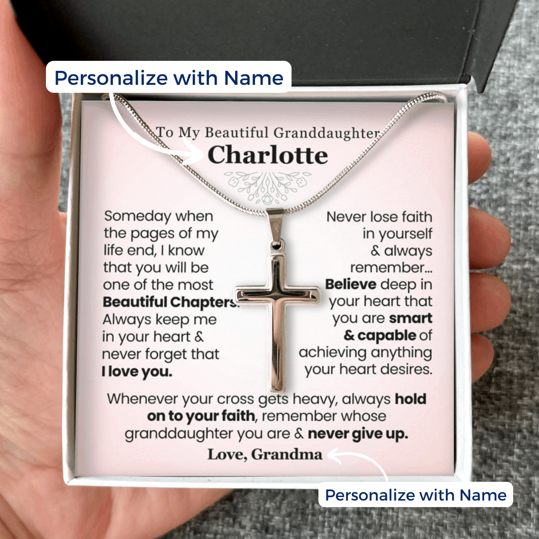 Necklace with cross pendant in a personalized message card held by a hand. Gift for granddaughter from grandma grandpa