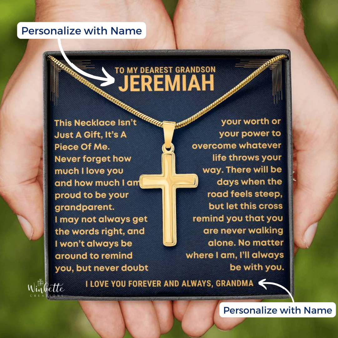 Gold Cross necklace in a gift box with personalized message, held by a hand. gift for grandson from grandfather.