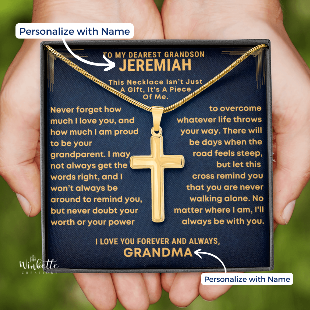 Gold Cross necklace in a gift box with personalized message, held by a hand. gift for grandson from grandfather