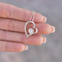 Thumbnail for Close-up of silver heart Forever Love Necklace with sparkling cubic zirconia pendant.