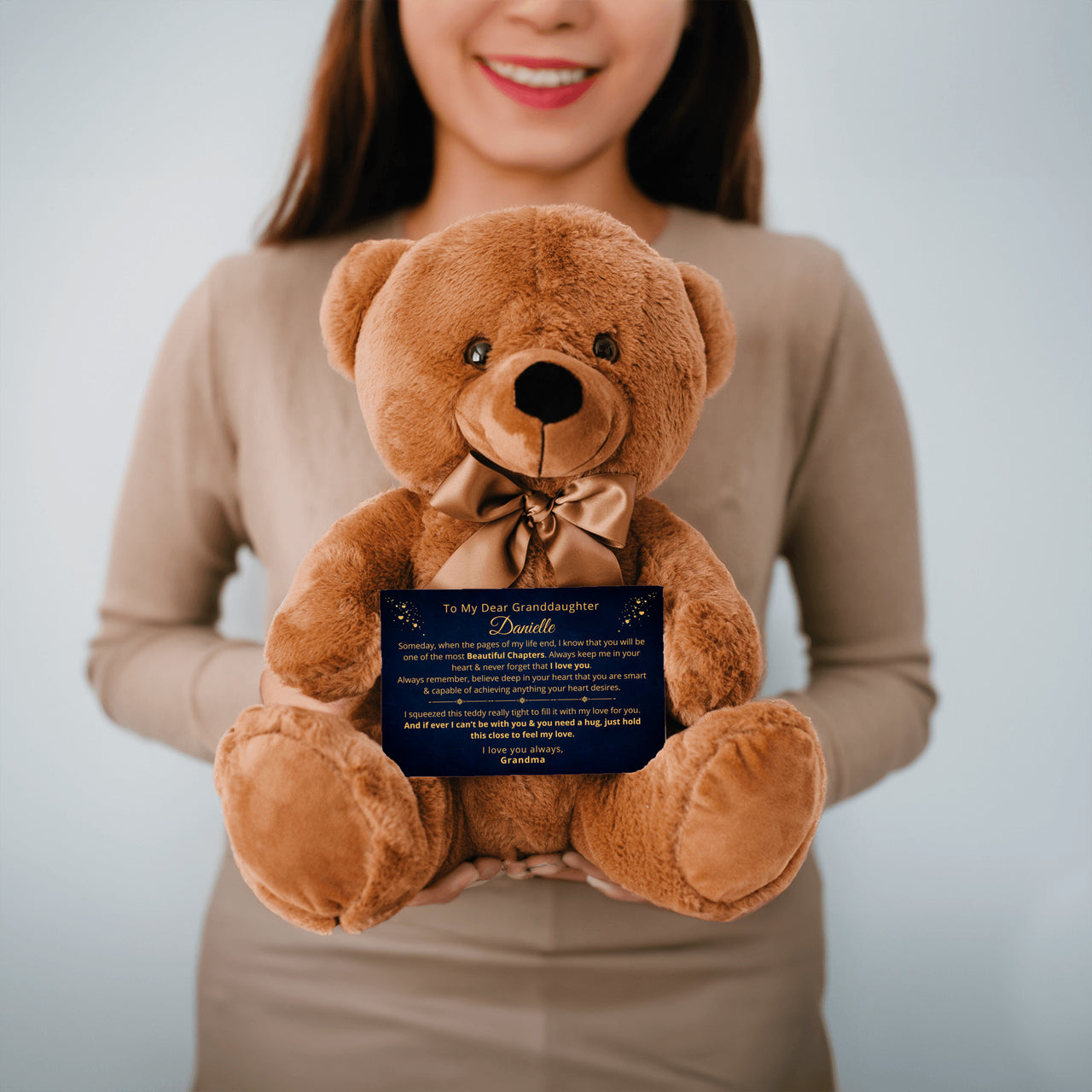 A brown teddy bear with a personalized canvas message card, showing options for customization with names. Gift for granddaughter