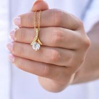 Thumbnail for Alluring Beauty Necklace held in hand showing pendant size and elegant design.
