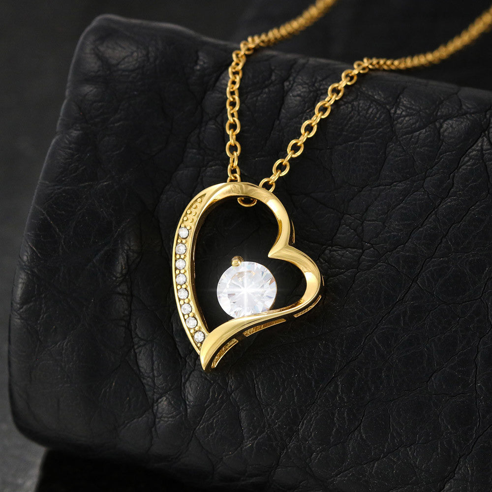Romantic heart-shaped gold pendant necklace with sparkling cubic zirconia - perfect anniversary gift for wife from husband.