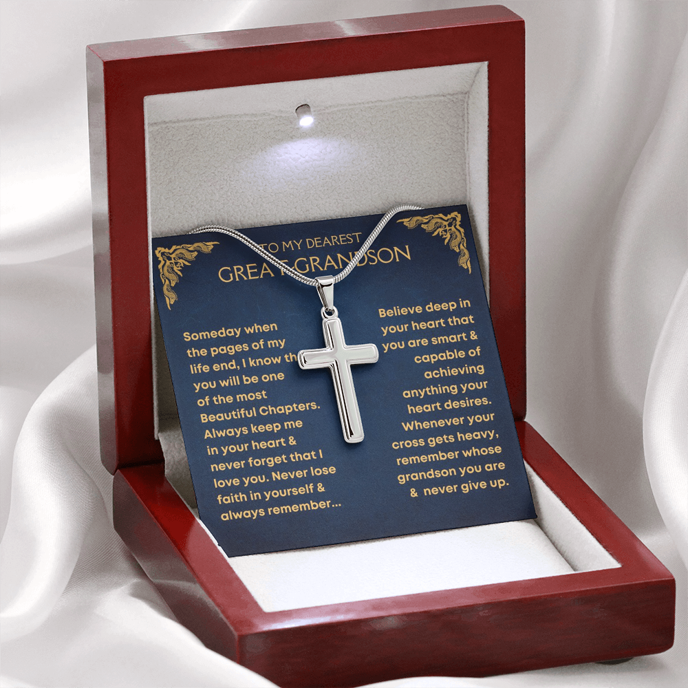 A silver cross necklace on a chain, presented in a luxury box with a message card for a great-grandson.