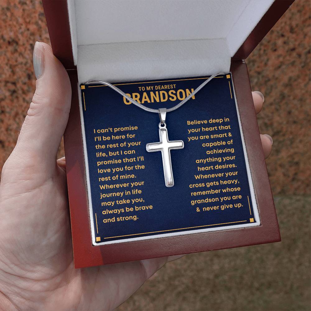 Coss necklace in a decorative box with personalized message to a grandson from grandma grandpa.