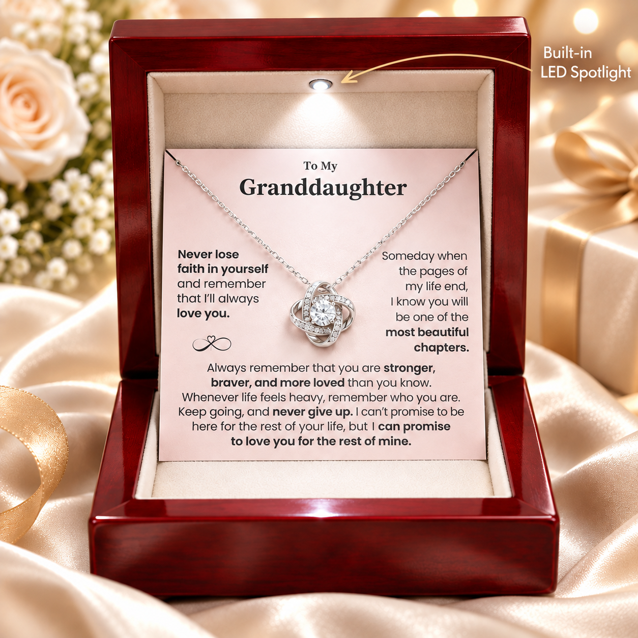 Luxury red wooden jewelry box with built-in LED spotlight, silver Love Knot necklace, and pink “To My Granddaughter” message card, sentimental granddaughter gift from grandma.
