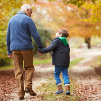 Thumbnail for Grandparent and grandson bonding moment — silver cross necklace sentimental gift.