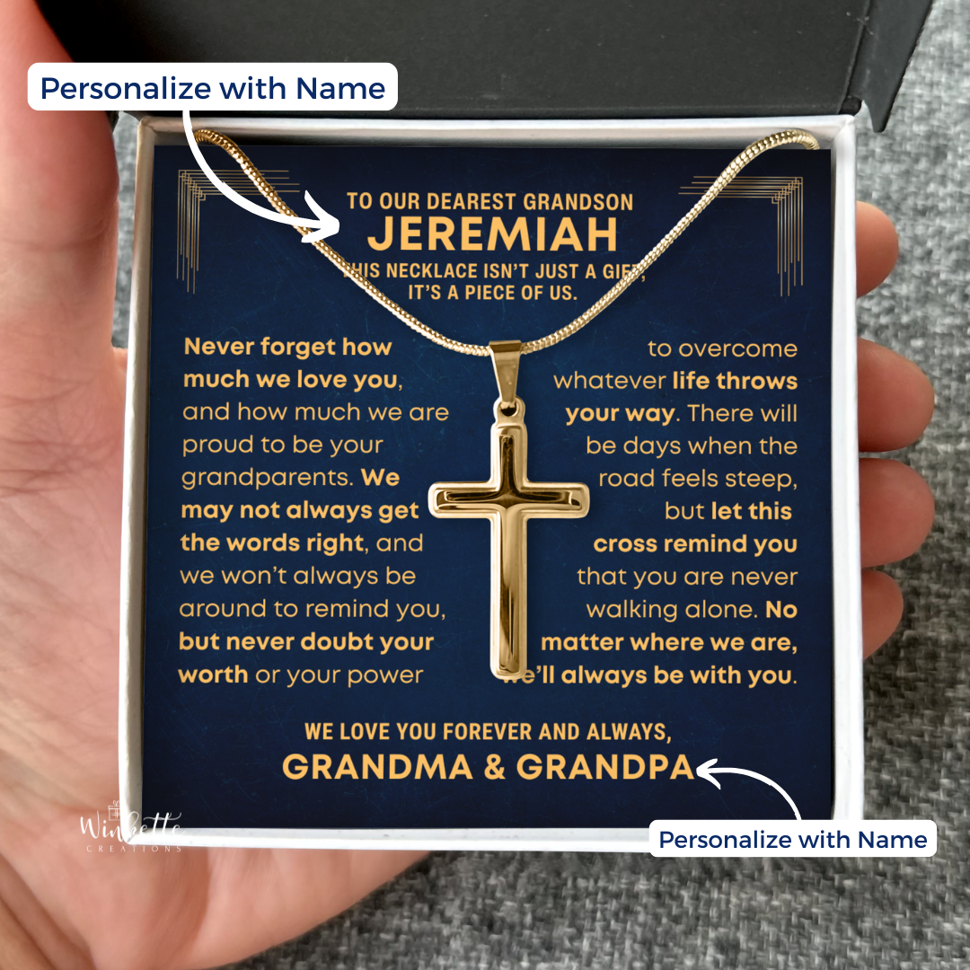 Grandson Gold Cross Necklace with personalized message card in a box, held by a hand. Gift for grandson from grandma grandpa