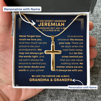 Thumbnail for Grandson Gold Cross Necklace with personalized message card in a box, held by a hand. Gift for grandson from grandma grandpa