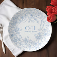 Thumbnail for Round polymer plate with decorative pattern on a wooden table with a white napkin and red tulips.