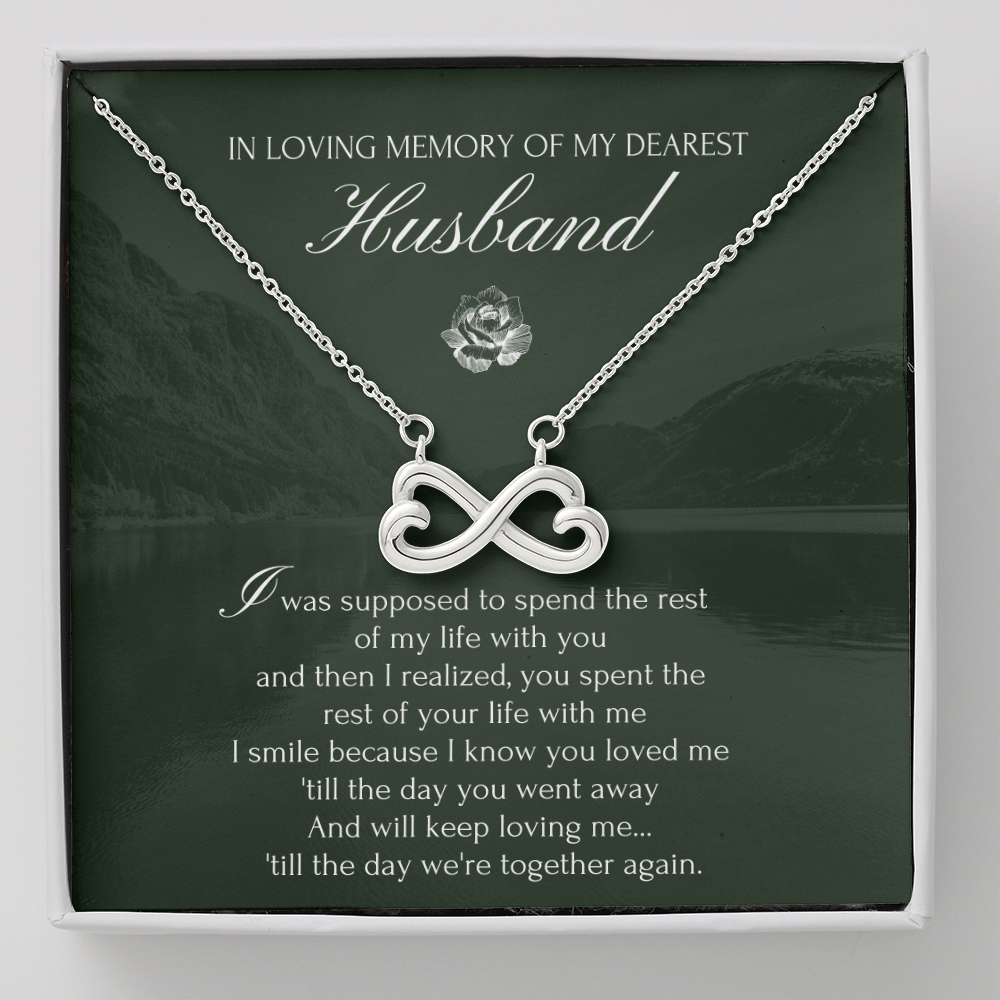 An infinity heart-shaped necklace on an adjustable chain, presented in a box with a message for a husband.